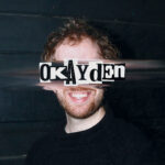 Okayden’s “Sugar Water – Polybit Remix” Is a DnB-Laced Celebration of Queer Love and Global Collaboration